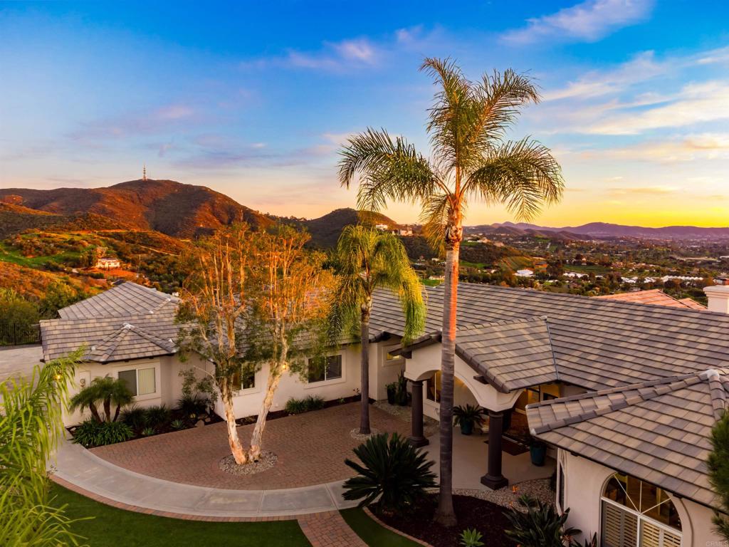 1966 Las Lomas Vista, CA 92084 - Photo 7 of 48 a view of a lake with a house in the background