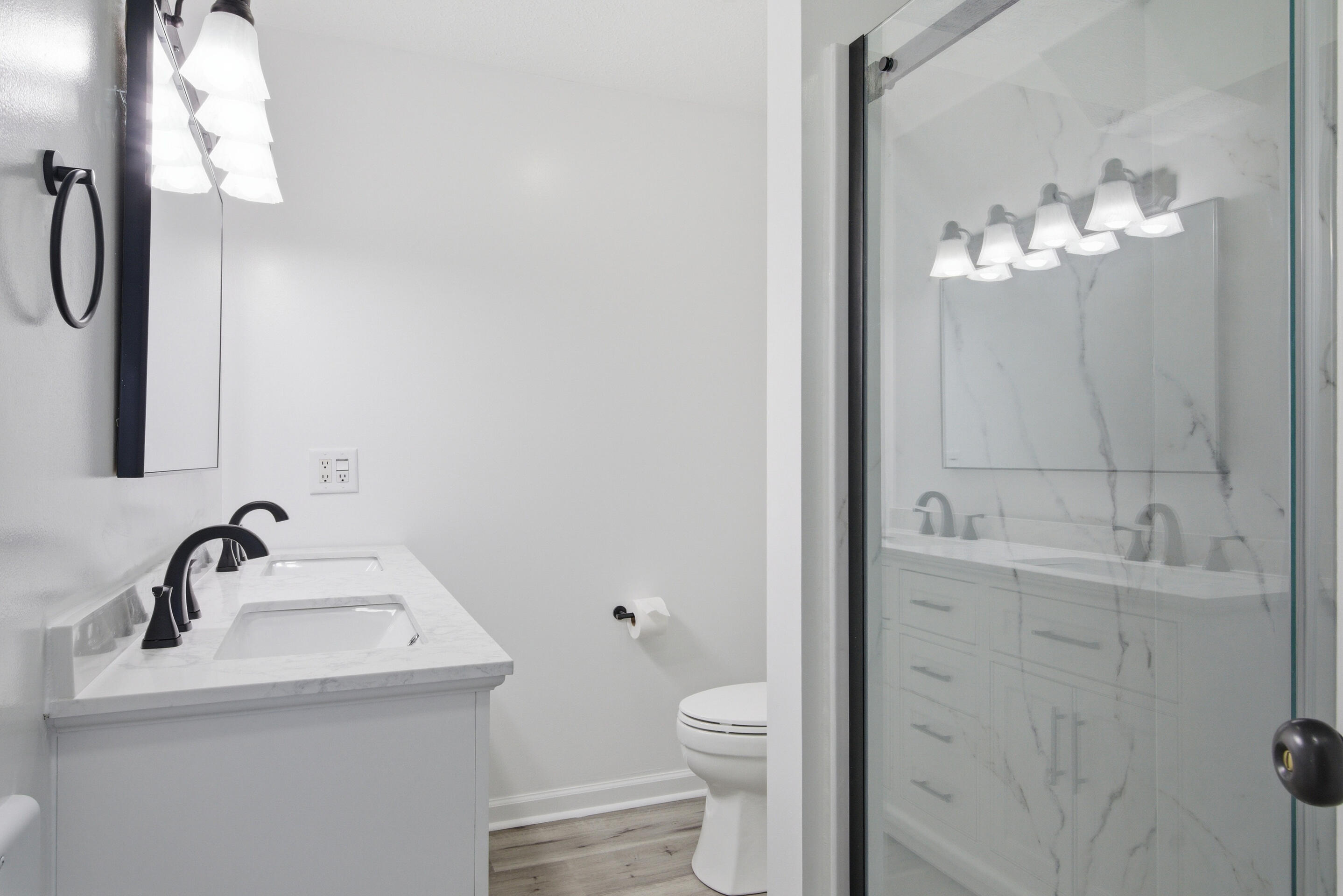 6458 Piney Woods Road Riner, VA 24149 - Photo 17 of 50 a bathroom with a sink a toilet and mirror