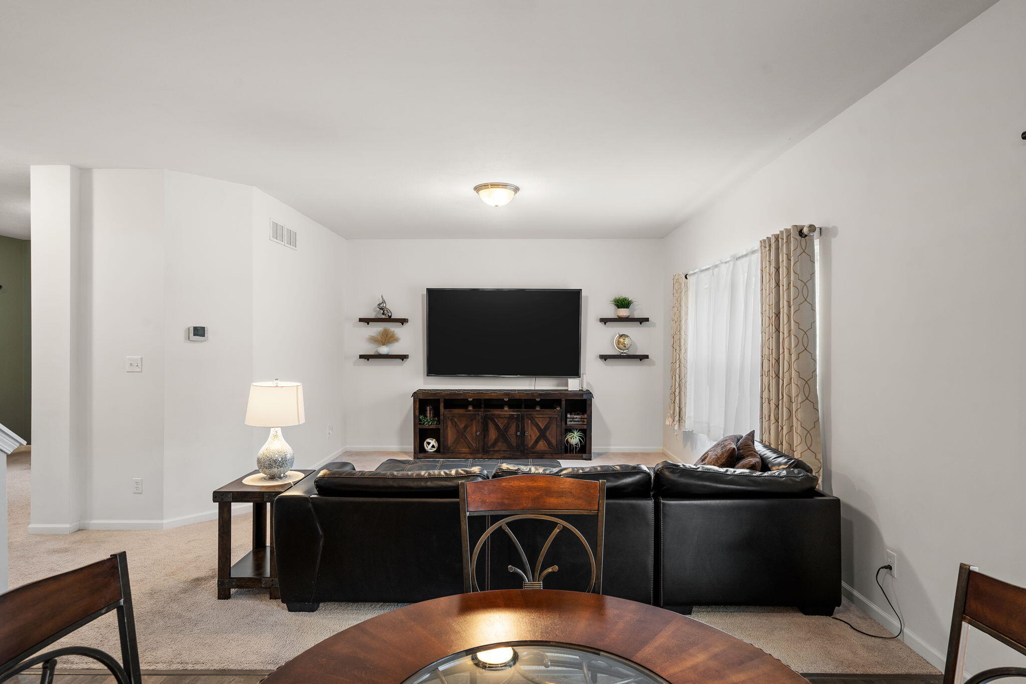 2434 Jupiter Street Portage, IN 46368 - Photo 11 of 30 a living room with furniture and a flat screen tv