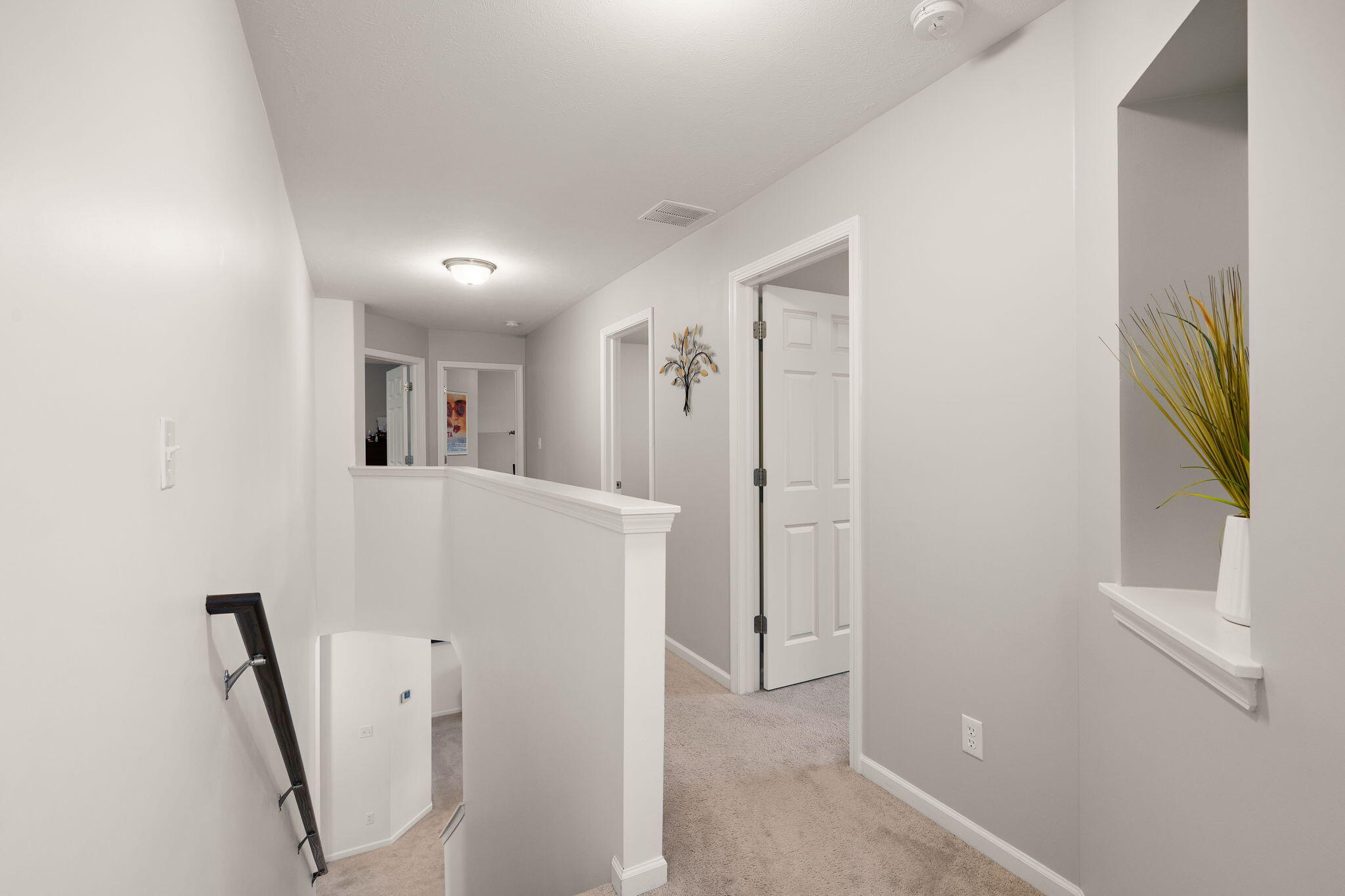 2434 Jupiter Street Portage, IN 46368 - Photo 21 of 30 a view of a hallway with furniture and wooden floor