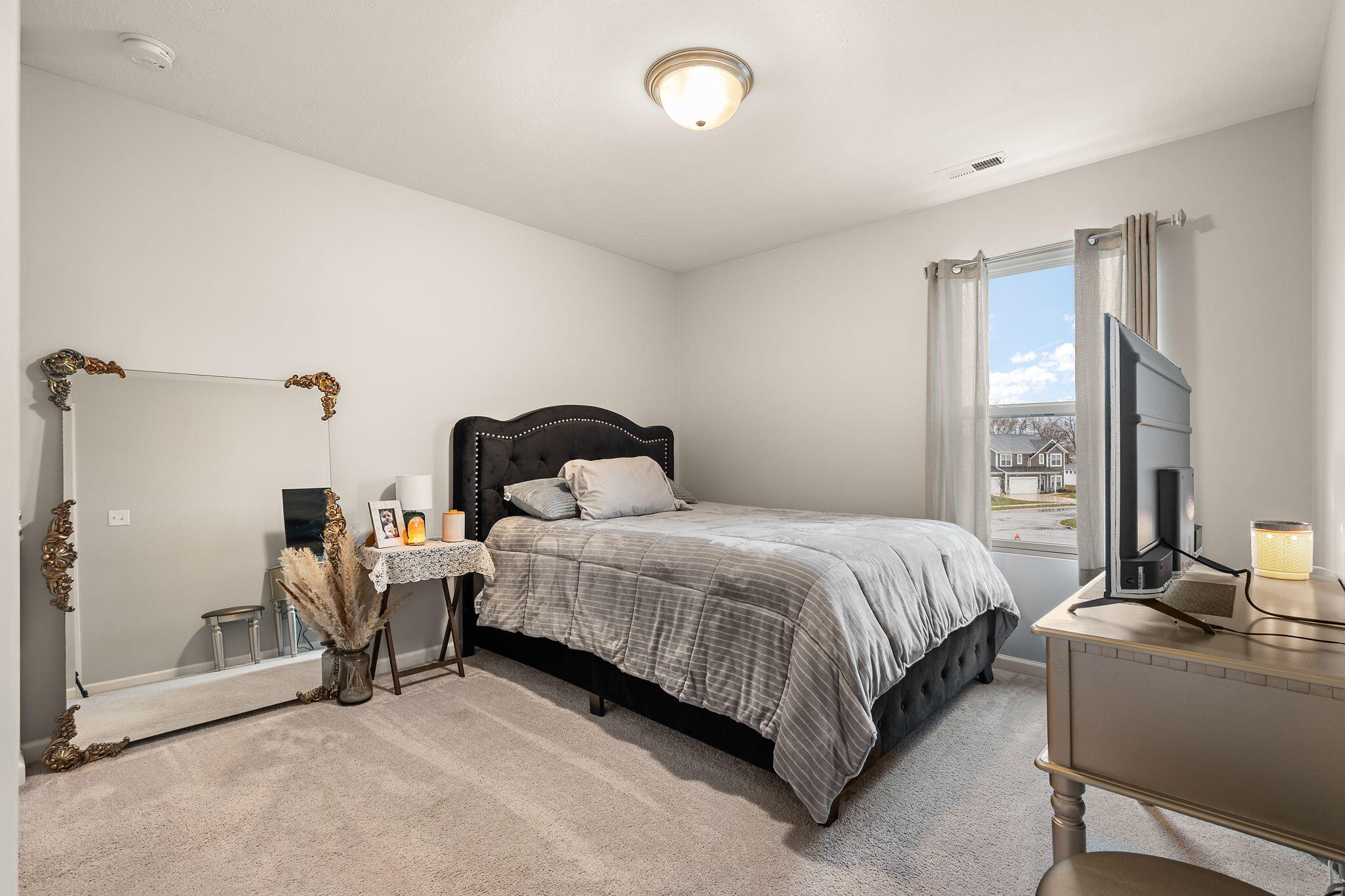 2434 Jupiter Street Portage, IN 46368 - Photo 25 of 30 a bedroom with a bed and a dresser
