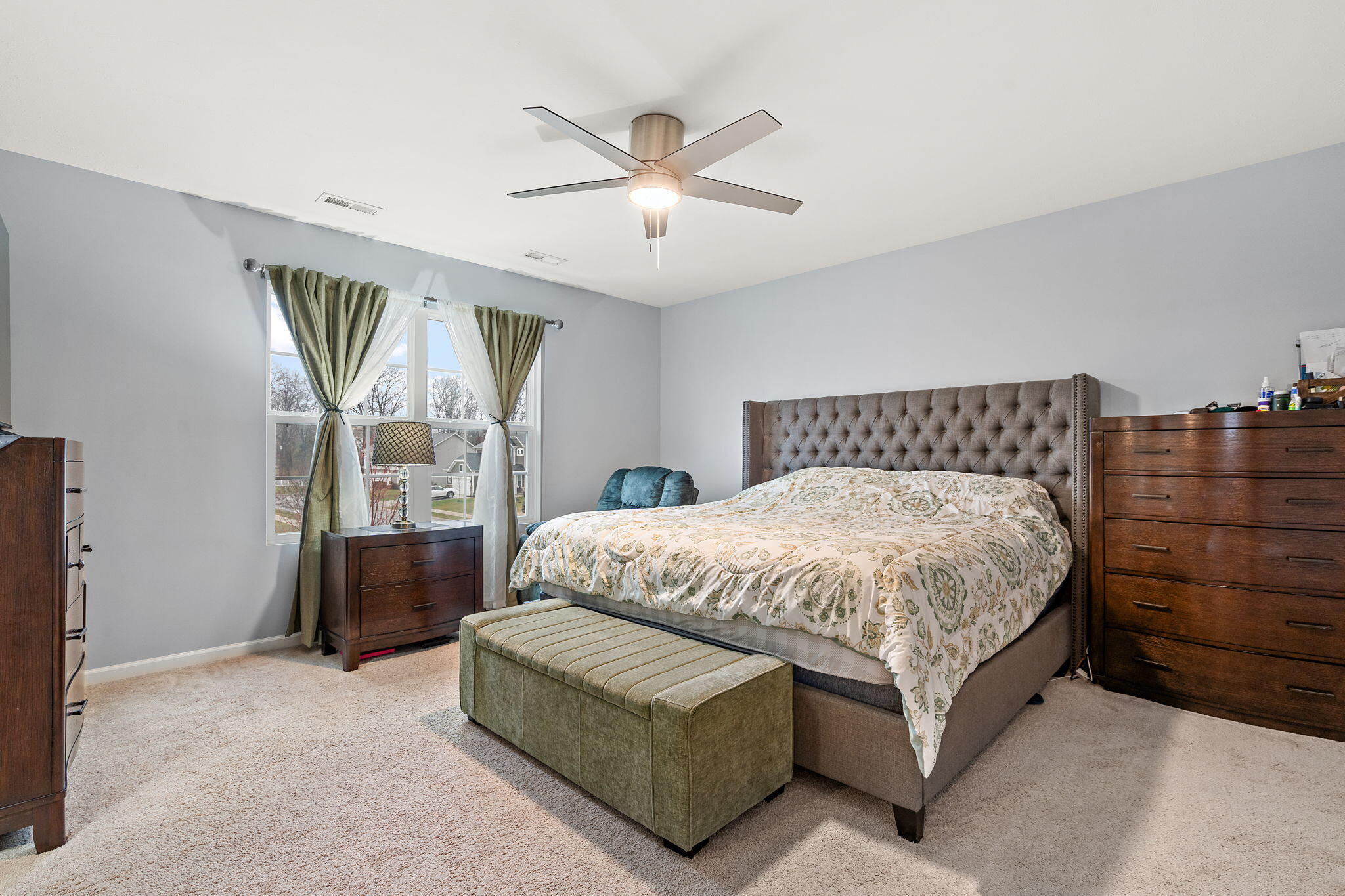 2434 Jupiter Street Portage, IN 46368 - Photo 26 of 30 a spacious bedroom with a bed and window