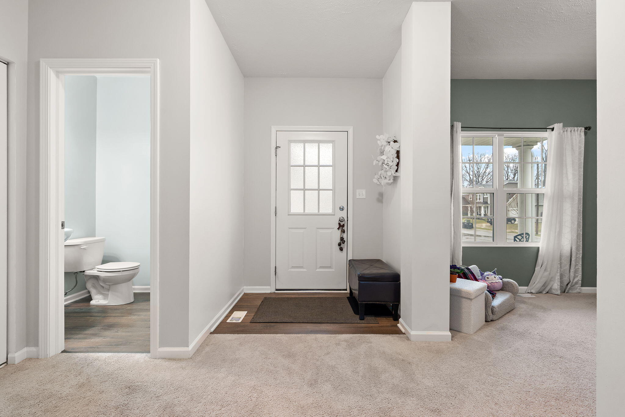 2434 Jupiter Street Portage, IN 46368 - Photo 5 of 30 a spacious bedroom with a bed and a window