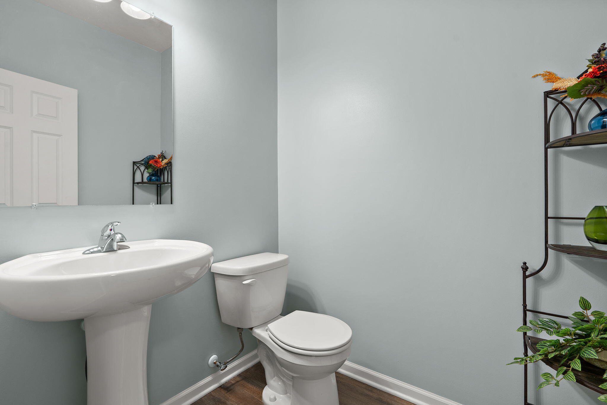 2434 Jupiter Street Portage, IN 46368 - Photo 6 of 30 a bathroom with a toilet sink and mirror