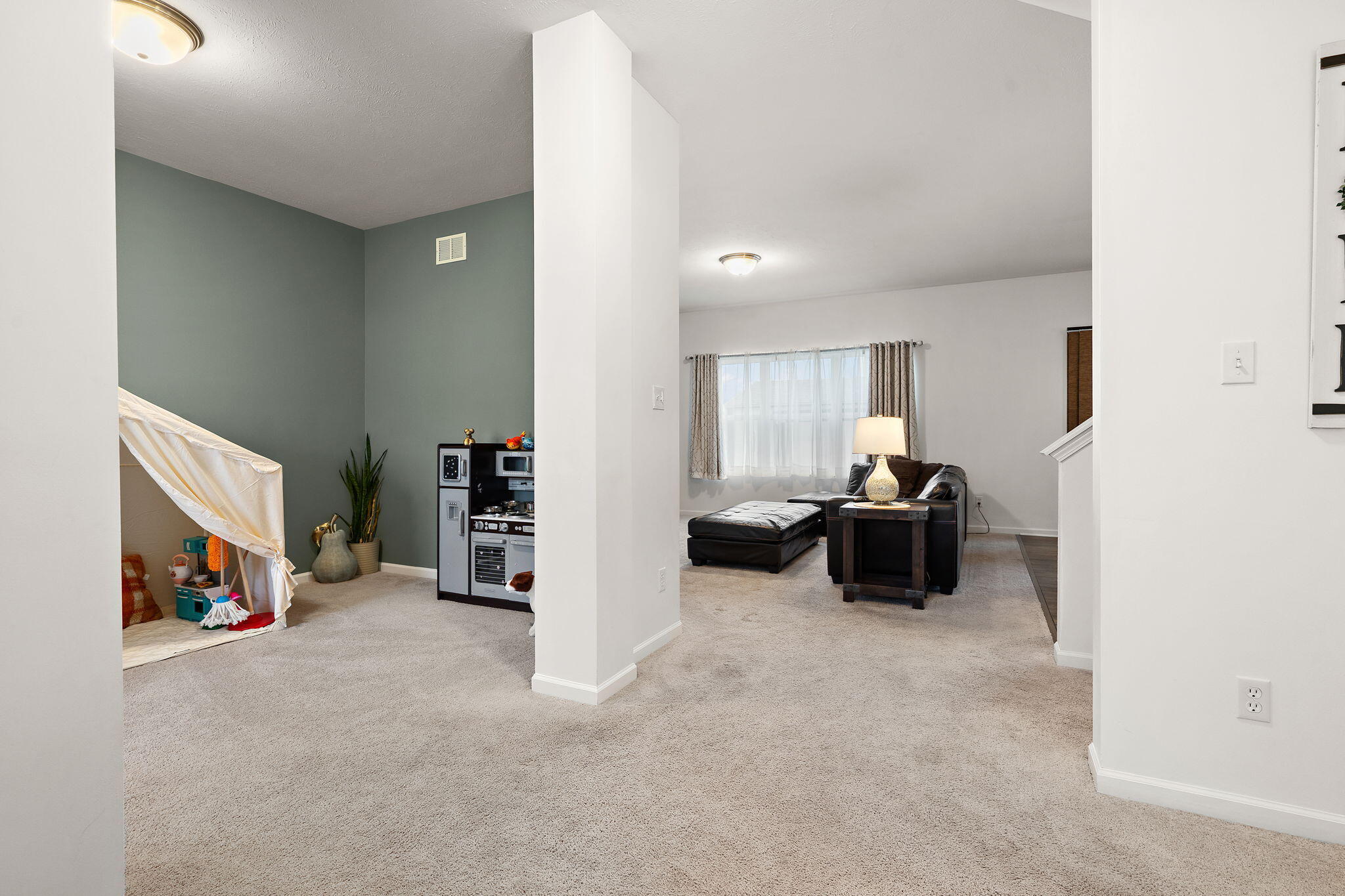2434 Jupiter Street Portage, IN 46368 - Photo 7 of 30 a living room with furniture and a flat screen tv