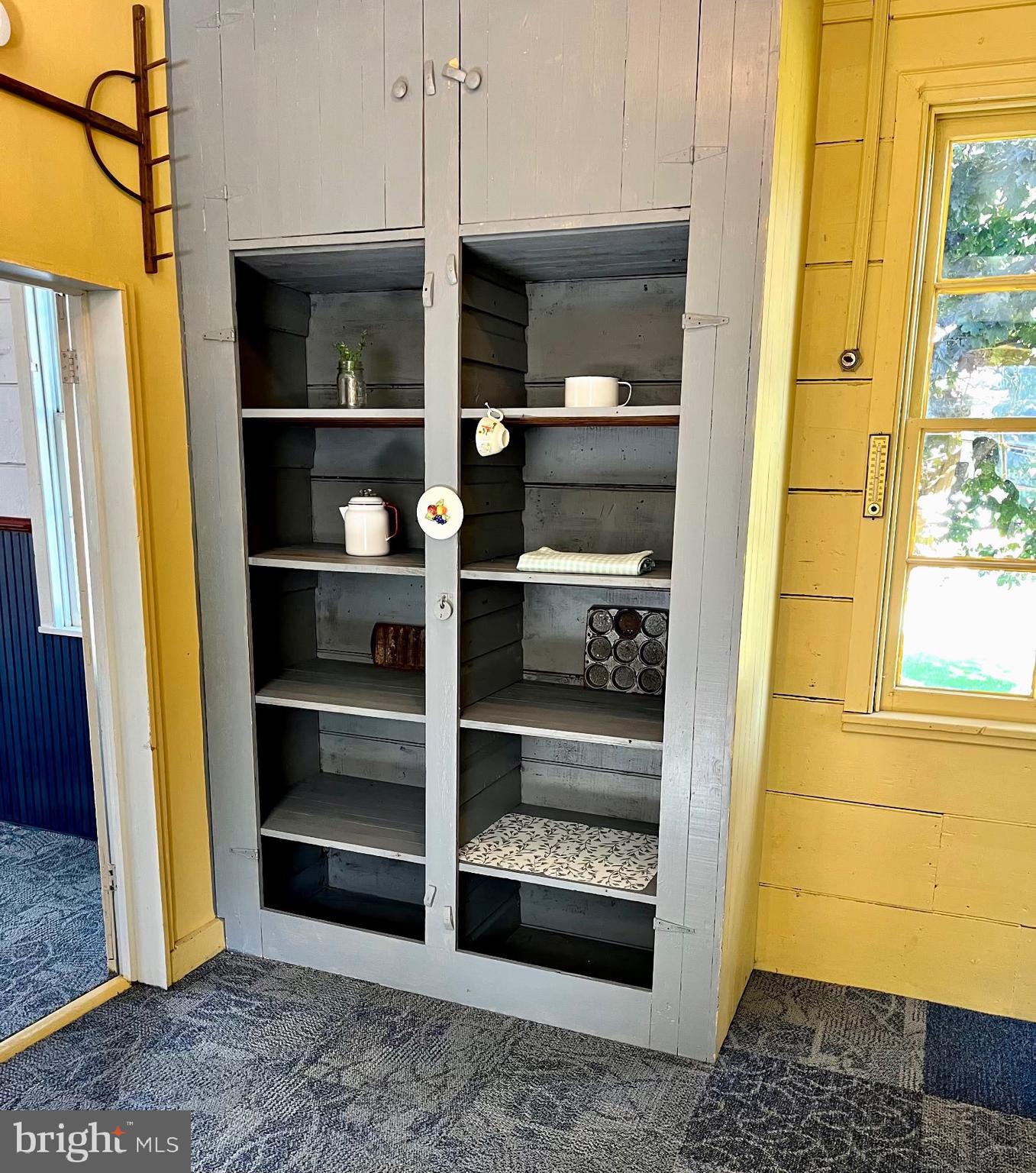 3459 Uniontown Road Westminster, MD 21158 - Photo 12 of 29 a living room with a fireplace and cabinets