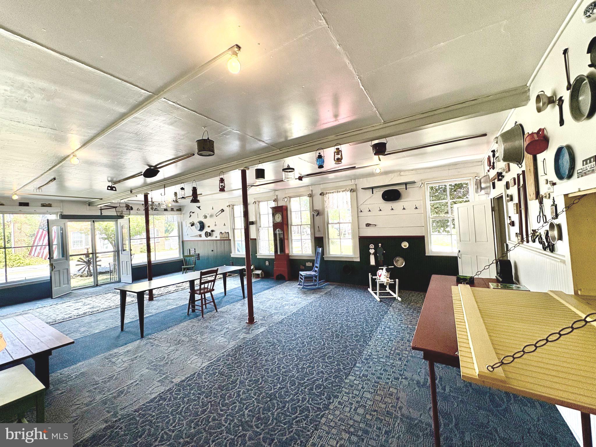3459 Uniontown Road Westminster, MD 21158 - Photo 5 of 29 a living room with furniture a window and gym equipment