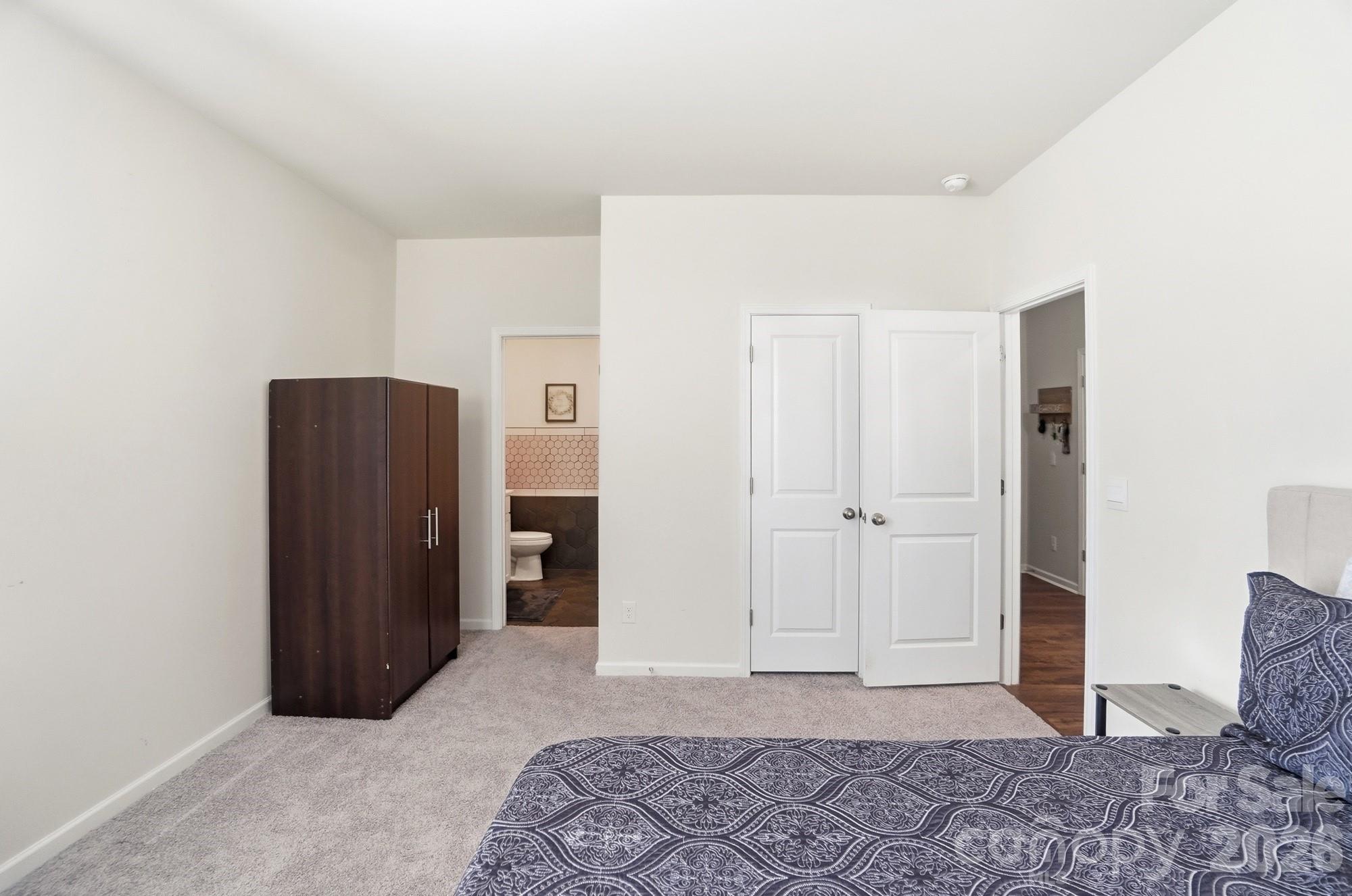 116 Timbergreen Court Troutman, NC 28166 - Photo 18 of 43 a view of room with walk in closet and wooden floor