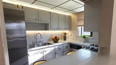 a kitchen with a sink cabinets and appliances