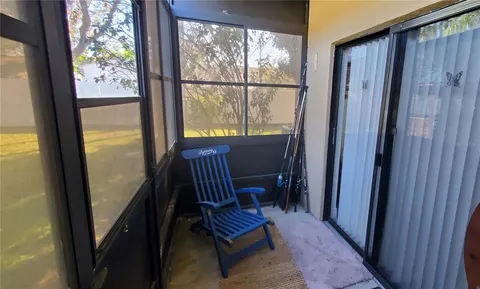 a view of two chairs in the balcony