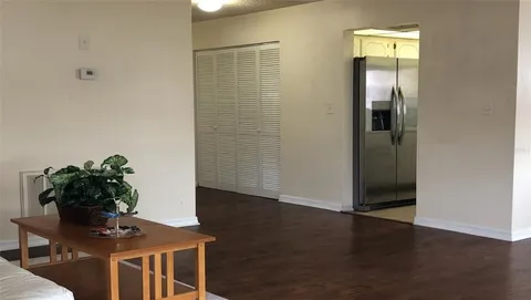 a view of a livingroom with furniture and wooden floor
