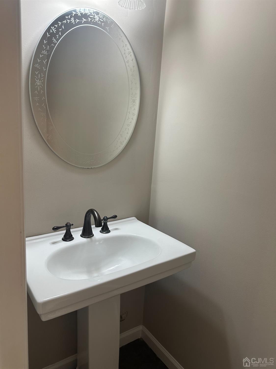 62 Goodwin Drive North Brunswick, NJ 08902 - Photo 12 of 23 a bathroom with a sink and a mirror