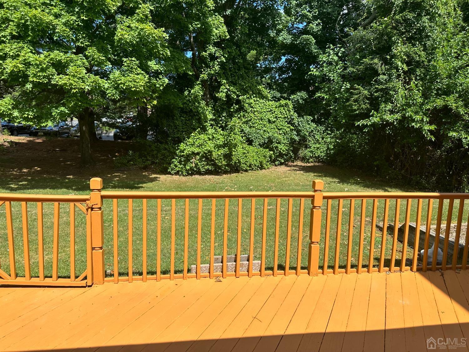 62 Goodwin Drive North Brunswick, NJ 08902 - Photo 19 of 23 a view of deck with a tennis court