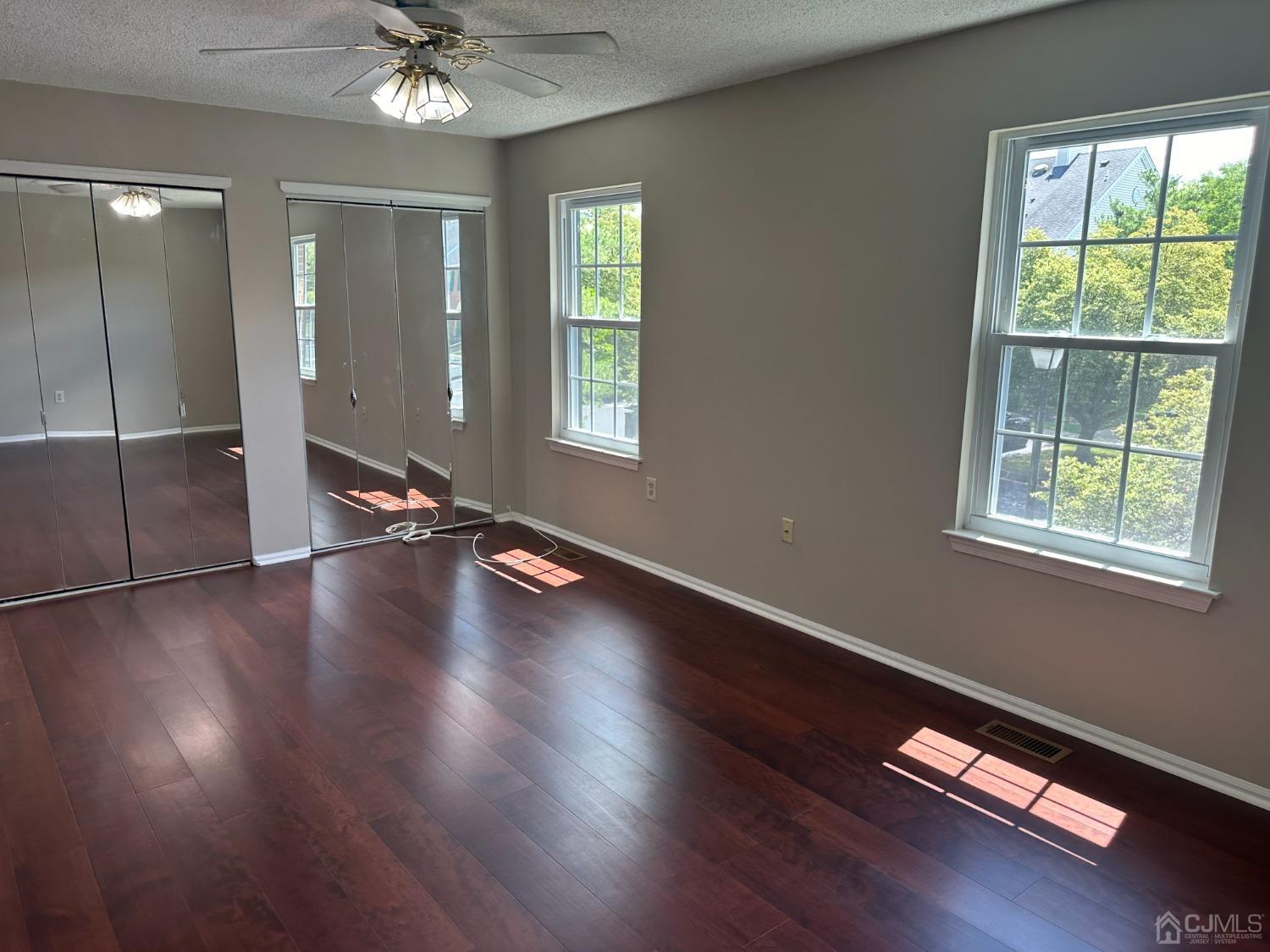 62 Goodwin Drive North Brunswick, NJ 08902 - Photo 5 of 23 a view of livingroom with hardwood floor and window