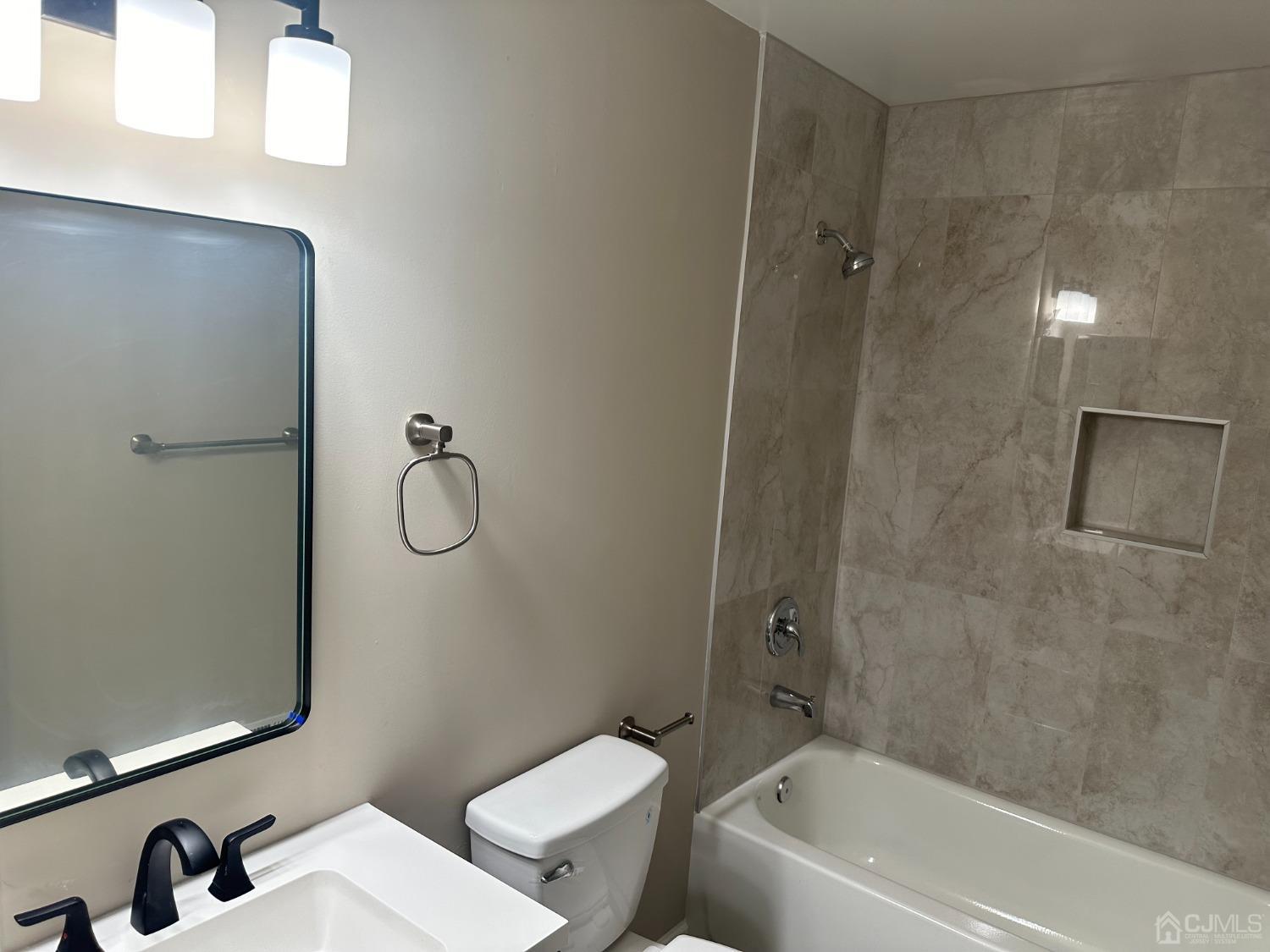 62 Goodwin Drive North Brunswick, NJ 08902 - Photo 6 of 23 a bathroom with a granite countertop bathtub shower sink vanity and toilet