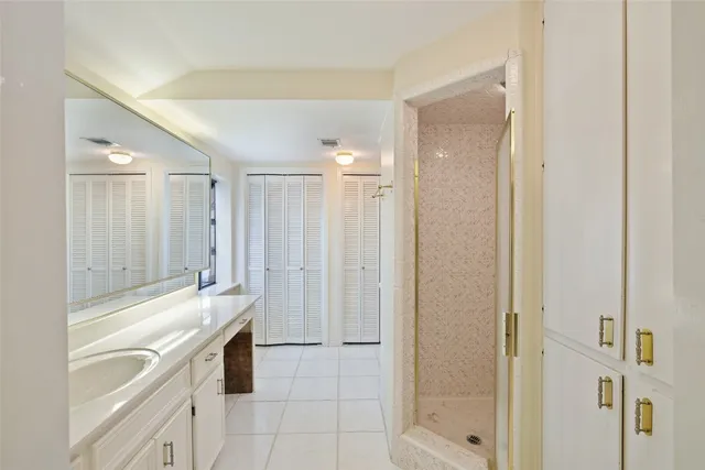 a spacious bathroom with a shower and a tub