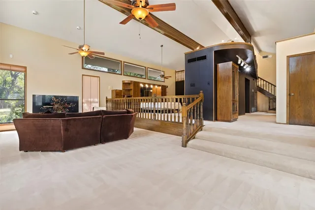 a view of living room with furniture and a window