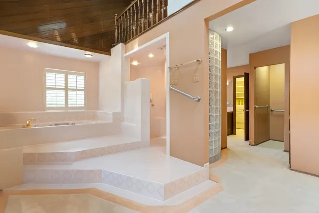 a bathroom with a bathtub and a shower