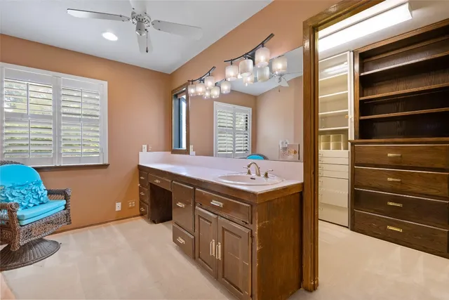 a bathroom with a sink a vanity and a mirror