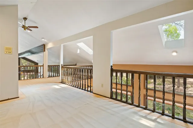 a view of a porch with wooden floor