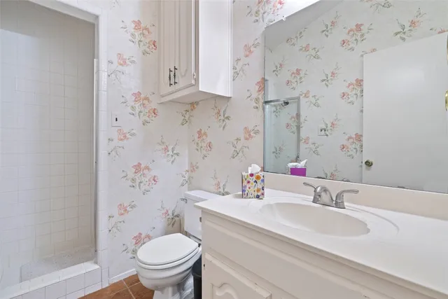 a large white kitchen with a large window