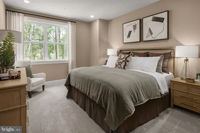 a bedroom with a large bed and furniture