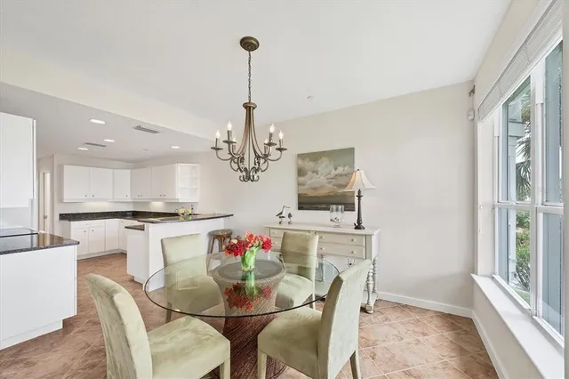 a living room with furniture and a bookshelf