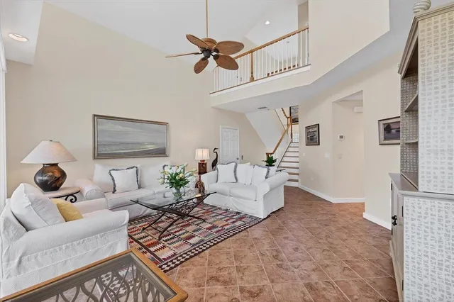 a view of staircase with wooden floor and white walls
