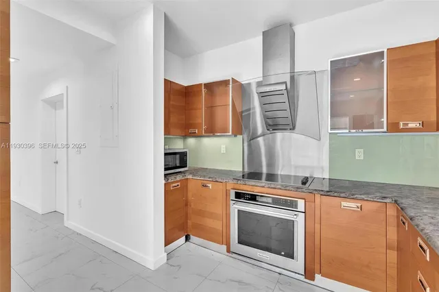 a kitchen with a sink stove and cabinets