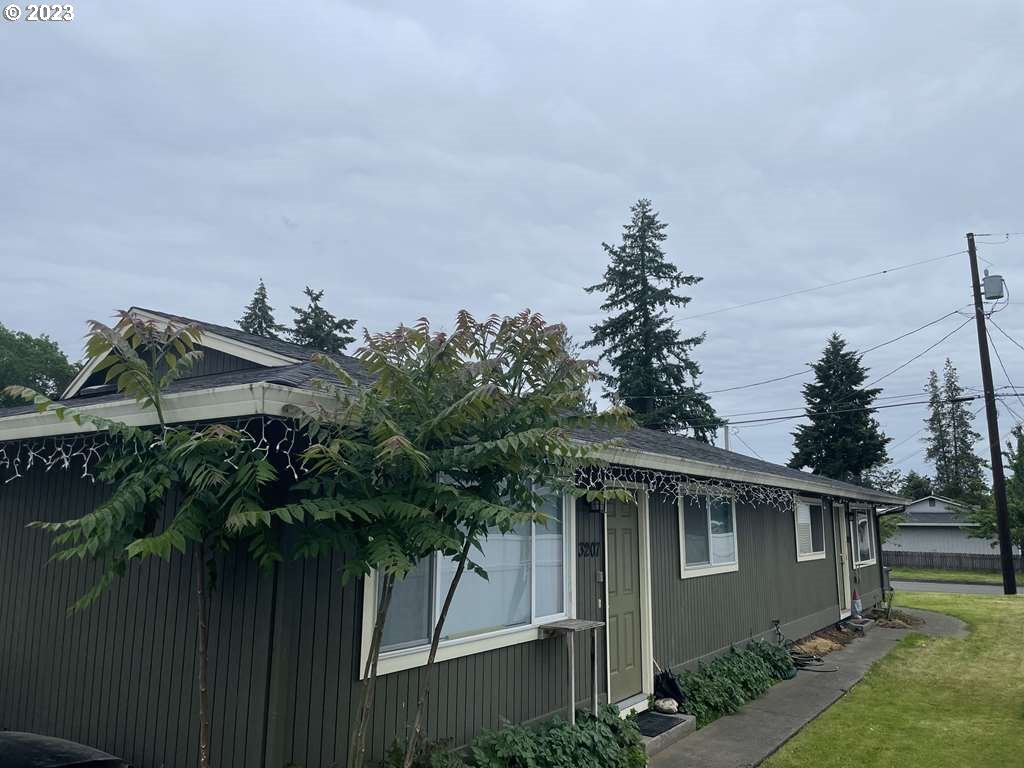 3205 W Street Vancouver, WA 98663 - Photo 1 of 6 a backyard of a house with lots of green space