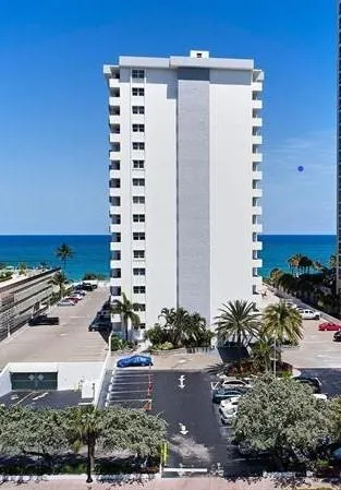 a picture of a building with a yard