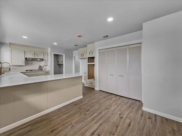a view of kitchen with wooden floor