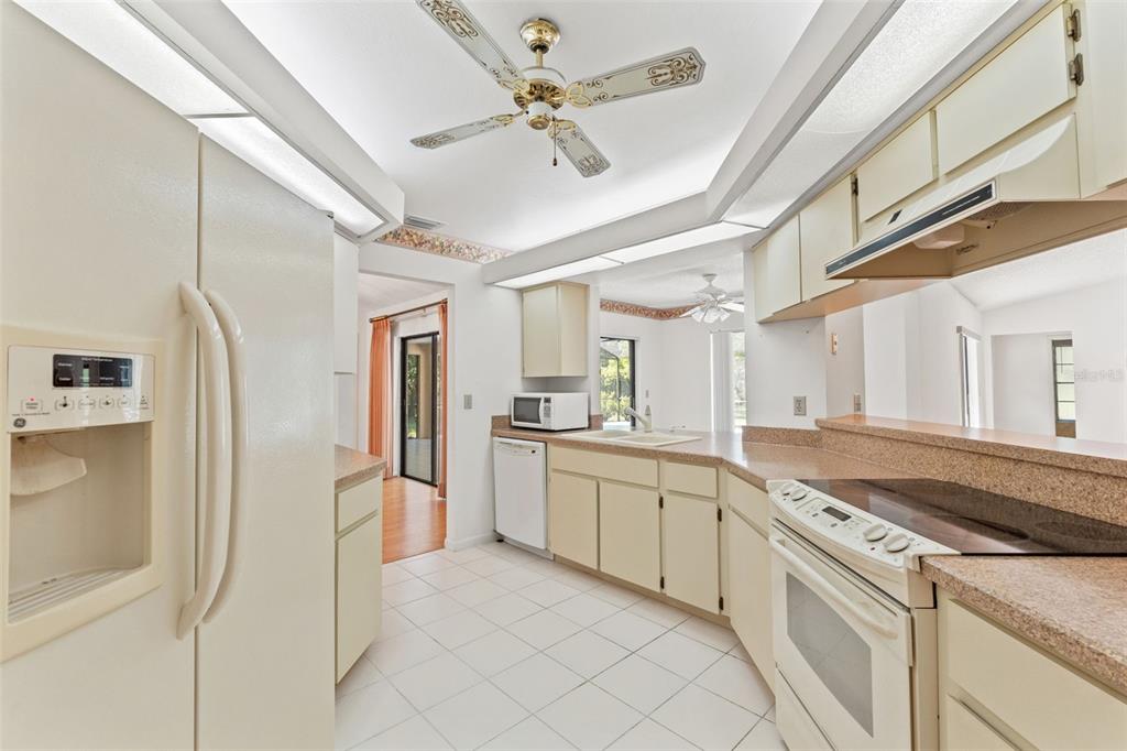 1379 Matthew Avenue Spring Hill, FL 34609 - Photo 13 of 55 a kitchen with cabinets and stainless steel appliances