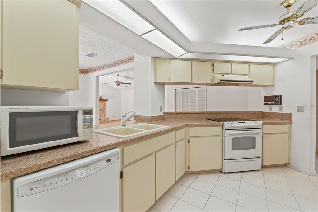 1379 Matthew Avenue Spring Hill, FL 34609 - Photo 15 of 55 a kitchen with cabinets appliances and a sink