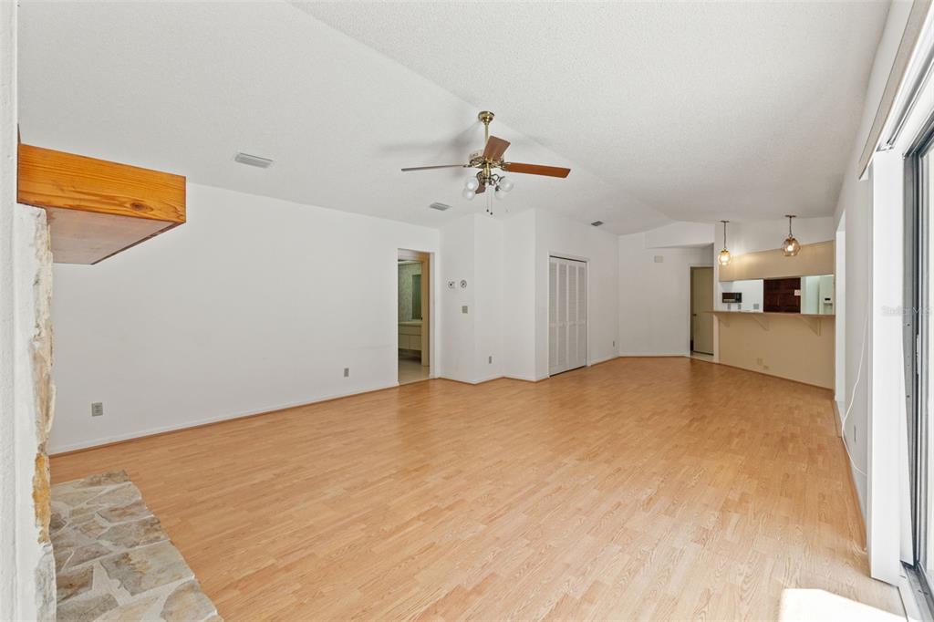 1379 Matthew Avenue Spring Hill, FL 34609 - Photo 23 of 55 a view of a bedroom with a bed and a chandelier fan