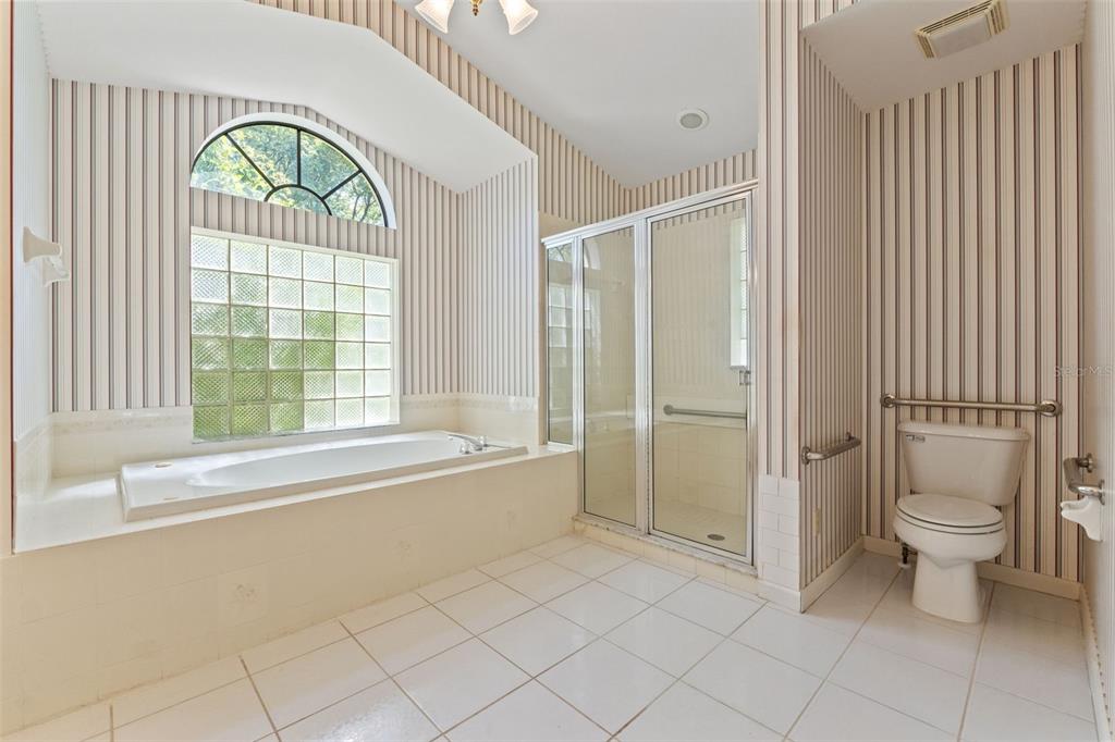 1379 Matthew Avenue Spring Hill, FL 34609 - Photo 29 of 55 a spacious bathroom with a bathtub and a shower