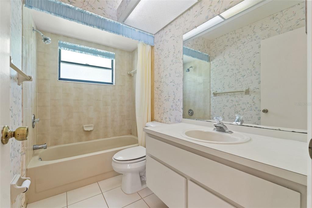 1379 Matthew Avenue Spring Hill, FL 34609 - Photo 38 of 55 a bathroom with a sink a toilet and shower