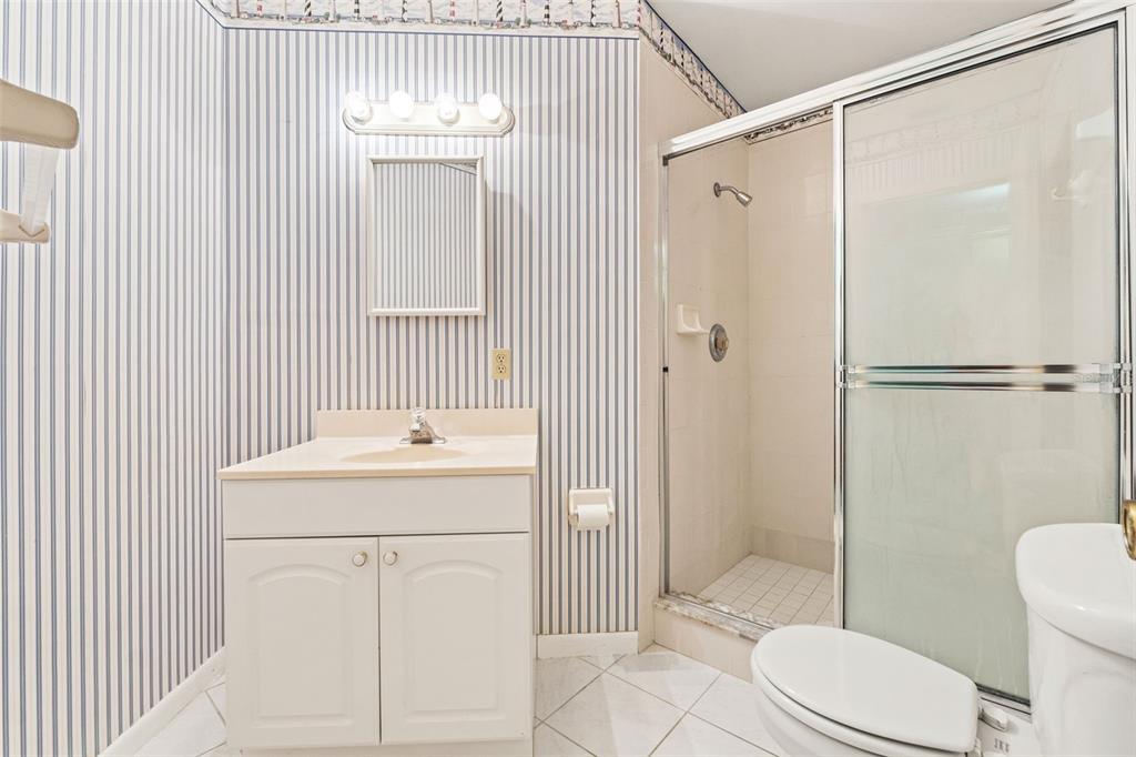 1379 Matthew Avenue Spring Hill, FL 34609 - Photo 39 of 55 a bathroom with a sink a toilet and shower