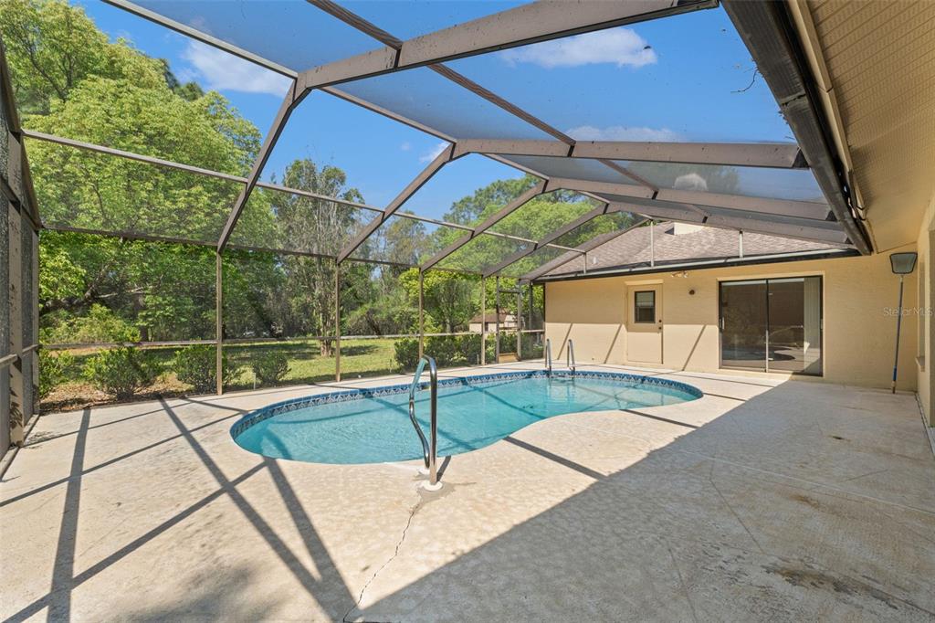 1379 Matthew Avenue Spring Hill, FL 34609 - Photo 46 of 55 a view of a patio with a table and chairs
