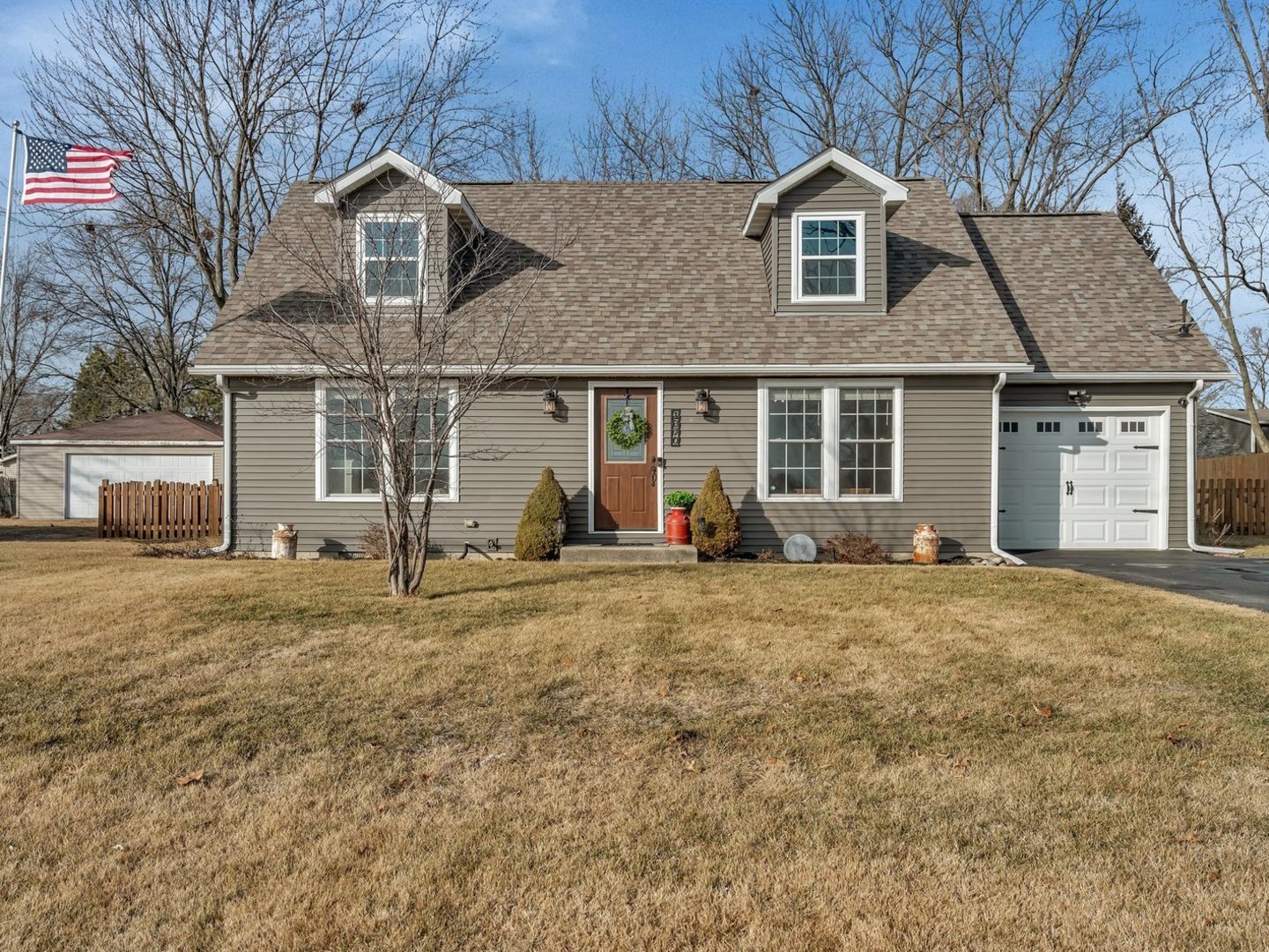 1070 West Kennedy Road Braidwood, IL 60408 - Photo 1 of 33 a front view of a house with a yard and garage