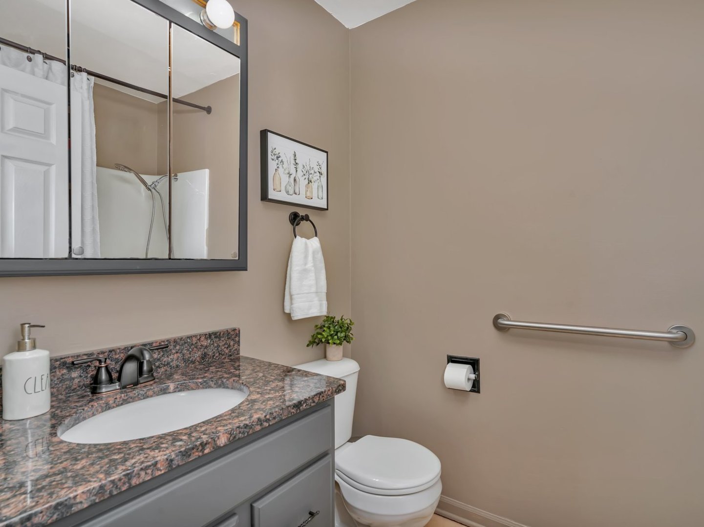1070 West Kennedy Road Braidwood, IL 60408 - Photo 14 of 33 a bathroom with a granite countertop sink a toilet and mirror