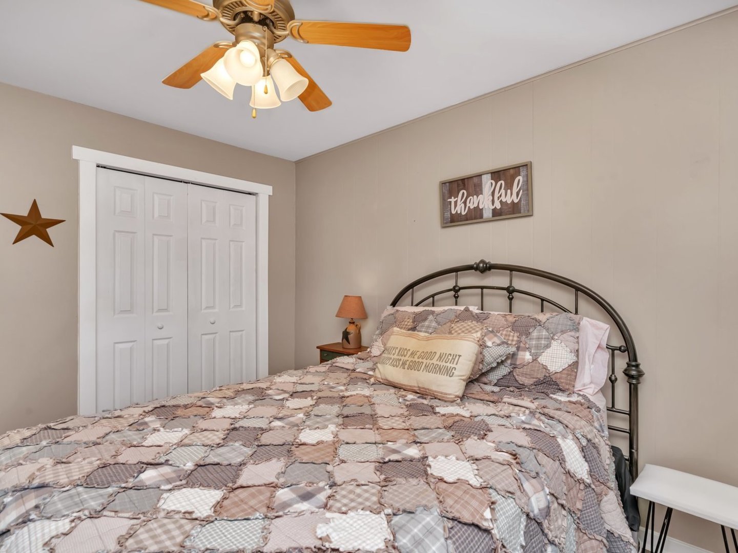 1070 West Kennedy Road Braidwood, IL 60408 - Photo 16 of 33 a bedroom with a bed and a chandelier