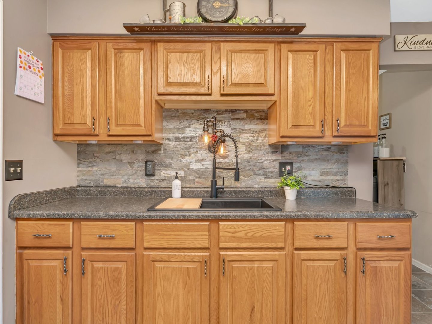 1070 West Kennedy Road Braidwood, IL 60408 - Photo 7 of 33 a kitchen with granite countertop white cabinets and window