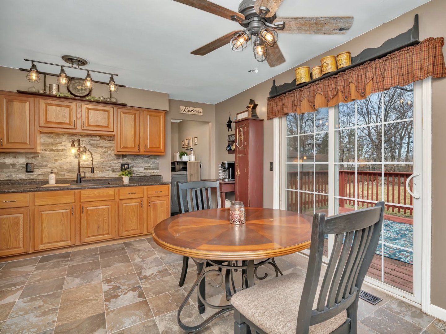 1070 West Kennedy Road Braidwood, IL 60408 - Photo 9 of 33 a kitchen with stainless steel appliances granite countertop a kitchen island a stove a table and chairs