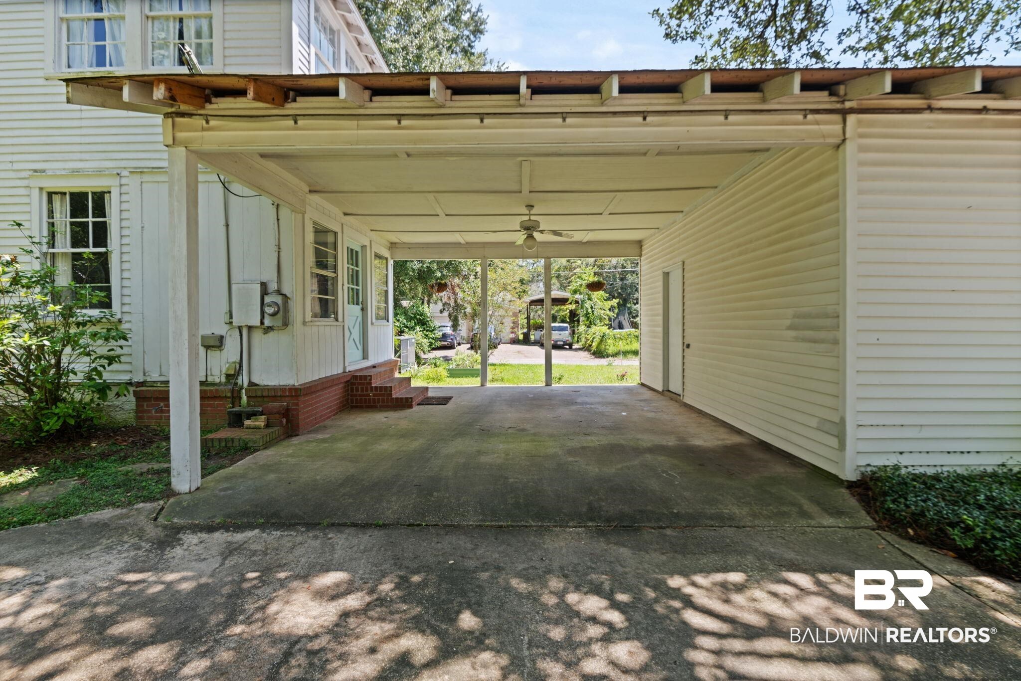 324 4th Street Mobile, AL 36611 - Photo 8 of 28 View of parking / parking lot featuring a carport