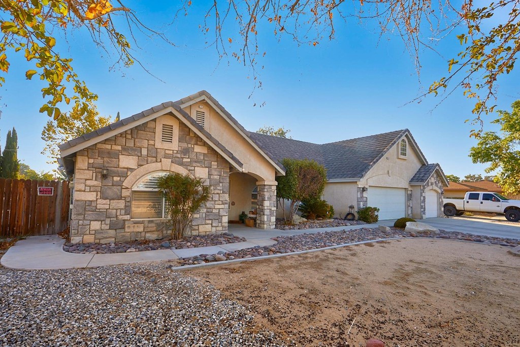 14447 Choco Road Apple Valley, CA 92307 - Photo 1 of 1 a view of a house with a yard