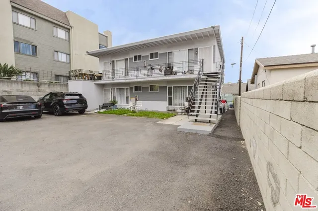 a view of multiple houses with a street