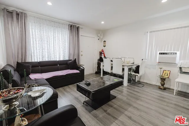 a living room with furniture and a rug