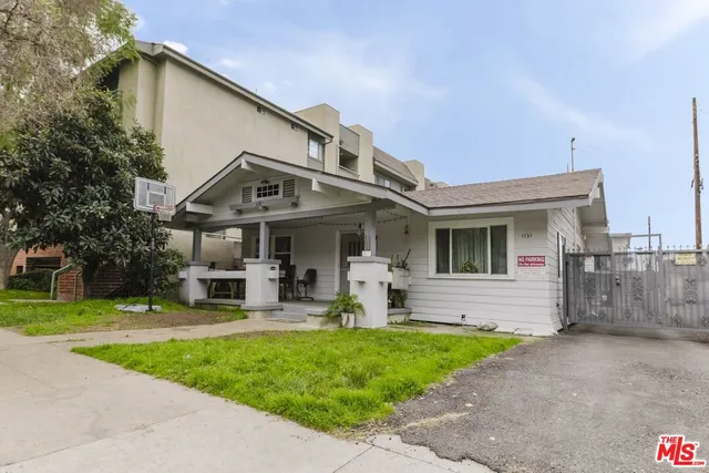 a front view of house with yard and outdoor seating
