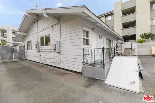 a view of a car park in front of a building